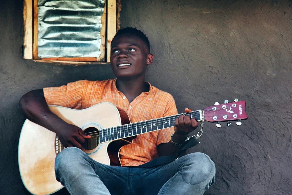 A man playing a guitar